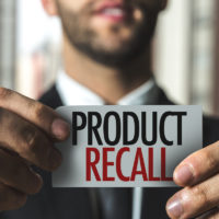 product recall caption held by businessman product recall caption held by businessman
