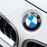 Mulhouse - France - 3 April 2018 - closeup of BMW Logo on white car, BMW is a german brand multinational company which currently produces automotive