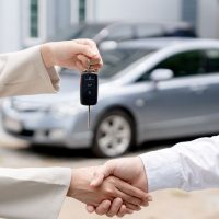 Dealership manager send car keys to the new owner. Sales, loan credit financial, rent vehicle, insurance, renting, Seller, dealer, installment, car care business