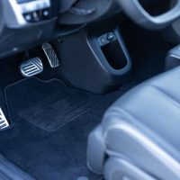 Electric car interior details. Vehicle Gas Brake Pedal, car pedals. Detailing of modern electric car, Brake and accelerator pedal of electric car interior. Brakes and accelerator pedals EV vehicle