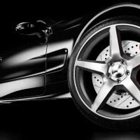 Black luxury car in studio lighting.